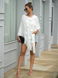 Haute Edition Women's Solid Fringed Sweater Poncho with Pom Poms. One size fits all (S-XL). Daily Haute